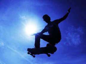 A skateboarder jumps at the banks of the Rhine in Mainz, Germany.