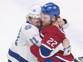 Tampa Bay Lightning centre Steven Stamkos (91) fights with Canadiens defenceman Karl Alzner (22) during first period of NHL game at the Bell Centre in Montreal on Feb. 24, 2018.