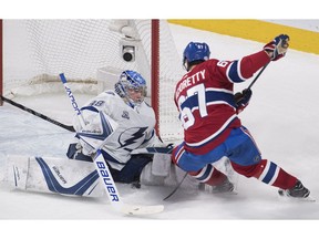 Tampa Bay Lightning goaltender Andrei Vasilevskiy makes a save against Canadiens' Max Pacioretty in Montreal on Saturday, Feb. 24, 2018.