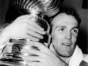Montreal Canadiens' Henri (Pocket Rocket) Richard hugs the Stanley Cup in Detroit opn May 5, 1966.