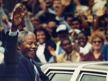 Nelson Mandela waves to crowd in Montreal on June 20, 1990.