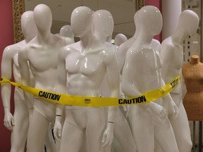 Mannequins are gathered for shipment at a retail store. None of them are wearing knight costumes.