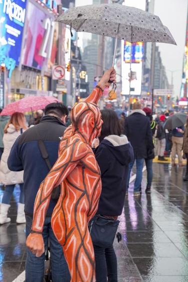 A nude model takes part in the Polar Bear Paint body-painting event in New York City's Times Square Feb. 10, 2018.