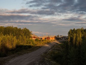 Early morning sunlight hits homes in the First Nation reserve of Opitciwan, 600 kilometres north of Montreal on Sunday, September 1, 2013. Opitciwan is an Atikamekw First Nations reserve with around 2,000 inhabitants located in the north shore of the Gouin Reservoir in the Quebec region of Mauricie.