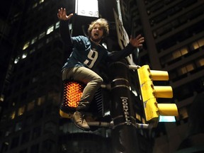 A Philadelphia Eagles fan celebrates the team's victory in the NFL Super Bowl 52 between the Philadelphia Eagles and the New England Patriots, Sunday, Feb. 4, 2018, in downtown Philadelphia.