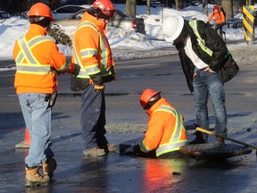 City of Montreal workers begin work at the site of a water-main leak at corner of de Lorimier and Rachel Aves.