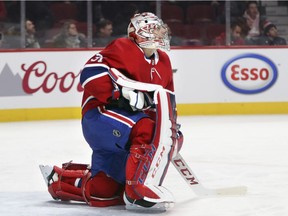 Canadiens goalie Carey Price takes break during stoppage of play during game against the New York Islanders at the Bell Centre in Montreal on Jan. 15, 2018.