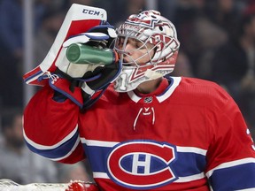 Montreal Canadiens' Carey Price takes a drink during second period against the New York Islanders in Montreal on Jan. 15, 2018.