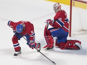 Montreal Canadiens goaltender Carey Price and Jordie Benn react after a goal by Boston Bruins' David Pastrnak at the Bell Centre on Jan. 20, 2018.