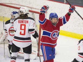 Les Canadiennes' Caroline Ouellette celebrates assist on a goal against Vanke Rays in Montreal on Jan. 28, 2018.