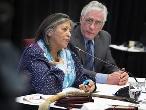 Mohawk community member Sedalia Kawennotas and commissioner Jacques Viens at the Viens Commission, a public inquiry into the mistreatment of Indigenous people in Quebec in 2018.