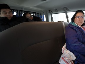 Charlotte Munik rides the native services shuttle after visiting her sick child at the Montreal Children's Hospital in Montreal on Friday