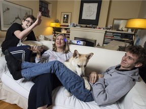 Lesley Chesterman's sons Luke, left, and Max were skeptical at first when their mom set up a home projector, but ended up playing along. Mia the dog also got in on the fun.