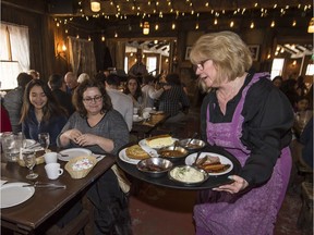 Left to right: Kelly and Margarida Do Santos have brunch delivered to them by Wendy Stoeff at the Sucrerie de la Montagne in Rigaud on Saturday, March 3, 2018.