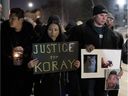 Friends and family gather for a vigil for Koray Kevin Celik in Pierrefonds Tuesday night Celik, 28, died during a police intervention last March. 