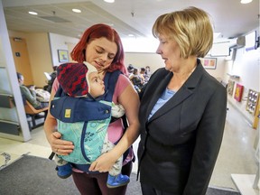 The Queen Elizabeth Health Complex was especially important to the late MP and city councillor Warren Allmand, says his wife, Rosemary Nolan, seen here with Melissa Reeds (left) and son Benjamin in the  waiting room dedicated to him. (John Mahoney / MONTREAL GAZETTE)