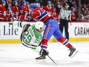 Montreal Canadiens Nicolas Deslauriers checks Dallas Stars Greg Pateryn during third period of National Hockey League game in Montreal Tuesday March 13, 2018.