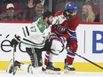 Dallas Stars Alexander Radulov pushes off Montreal Canadiens Jordie Benn during first period of National Hockey League game in Montreal Tuesday March 13, 2018.