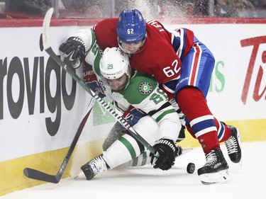 Montreal Canadiens Artturi Lehkonen checks Dallas Stars Greg Pateryn during first period of National Hockey League game in Montreal Tuesday March 13, 2018.