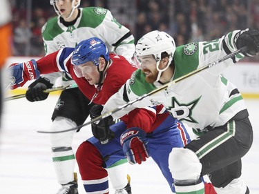 Dallas Stars Stephen Jones, right, slows down Montreal Canadiens Artturi Lehkonen during first period of National Hockey League game in Montreal Tuesday March 13, 2018.