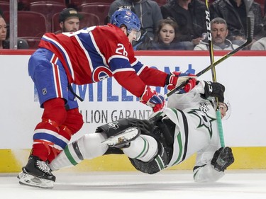 Montreal Canadiens Mike Reilly knocks down Dallas Stars Tyler Pitlick during second period of National Hockey League game in Montreal Tuesday March 13, 2018.