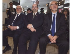 Quebec Health Minister Gaétan Barrette (left), Jacques-Cartier MNA Geoff Kelley (centre) and Robert-Baldwin MNA Carlos Leitão wait to speak at the super-clinic launch in Pointe-Claire on March 8.