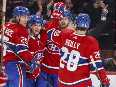 Montreal Canadiens Artturi Lehkonen, second from left, is congratulated by teammates Jacob de la Rose, Jeff Petry and Mike Reilly after scoring goal against the Pittsburgh Penguins during first period of National Hockey League game in Montreal, Thursday March 15, 2018.