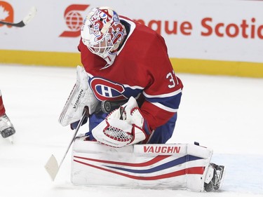 Montreal Canadiens Antti Niemi makes stops of a Pittsburgh Penguins shot during second period of National Hockey League game in Montreal, Thursday March 15, 2018.