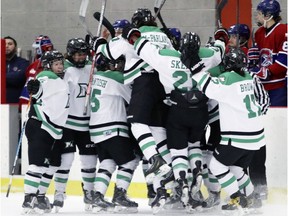Markham Thunder players celebrate in front of Les Canadiennes bench after Thunder's Jamie Lee Rattray scored the game-winning goal during overtime of Canadian Women's Hockey League playoff game in Montreal on Friday, March 16, 2018.