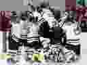 Markham Thunder players celebrate in front of Les Canadiennes bench after Thunder's Jamie Lee Rattray scored the game-winning goal during overtime of Canadian Women's Hockey League playoff game in Montreal on Friday, March 16, 2018.  