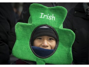 A young boy enjoys the 195th annual St. Patrick's Day parade in Montreal on Sunday, March 18, 2018.