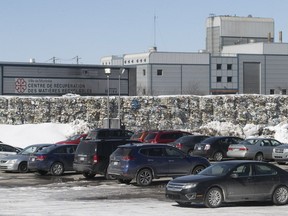 Bales of paper are stacked outside the St-Michel Environmental Complex on Monday, March 19, 2018.