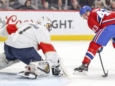 Montreal Canadiens Daniel Carr takes a between-the-legs shot on Florida Panthers Roberto Luongo during first period of National Hockey League game in Montreal Monday March 19, 2018.