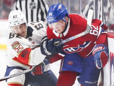 Florida Panthers Denis Malgin uses his stick to slow down Montreal Canadiens Artturi Lehkonen during first period of National Hockey League game in Montreal Monday March 19, 2018.