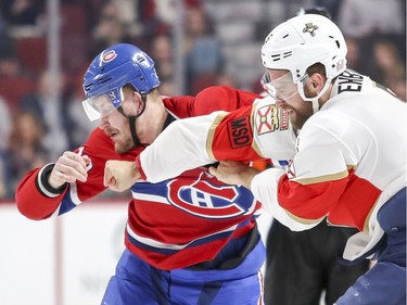 Montreal Canadiens Nicolas Deslauriers takes a punch from Florida Panthers Aaron Eklblad during first period of National Hockey League game in Montreal Monday March 19, 2018.