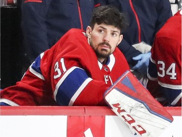 Montreal Canadiens Carey Price sits on the bench backing up starter Antti Niemi during first period of National Hockey League game against the  Florida Panthers in Montreal Monday March 19, 2018.