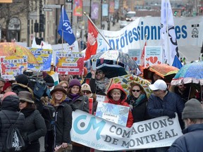Protesters prepare to march in downtown Montreal in protest over the Quebec government's decision to give medical specialists a big raise, while the rest of the public health system is desperately under funded Saturday, March 24, 2018.(Peter McCabe / MONTREAL GAZETTE) ORG XMIT: 60392