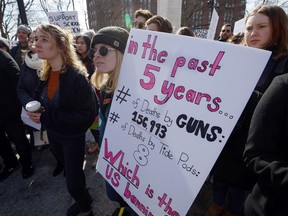 Protesters listen to speakers prior to the March for Our Lives in Montreal on Saturday, March 24, 2018. The weekend's widespread marches in support of gun control are just one sign of a political awakening among young people.