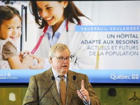 Quebec Health Minister Gaetan Barrette speaks at a press conference where Quebec Premier Philippe Couillard announced a new $1.5 billion hospital will be built in Vaudreuil-Dorion.
