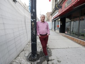 Elio Schiavi at Restaurant Ferrari on Bishop St. Though he remains, many merchants on the street have been forced out of business by the years-long construction outside their doors.