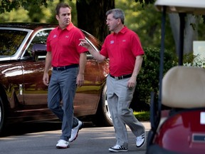 Geoff Molson, left, speaks with Donald Beauchamp during the Montreal Canadiens' charity golf tournament in Laval on Sept. 11, 2017.