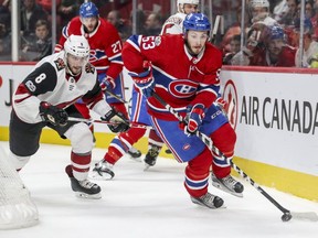 Canadiens rookie defenceman Victor Mete skates the puck away from Coyotes' Tobias Reider during game earlier this season.