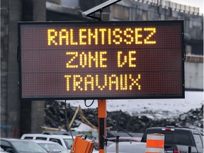 Signs that deal with safety, like this one urging motorists to slow down in a construction zone, should be bilingual or convey their message with a pictogram, Harold Staviss and Ruth Kovac write.