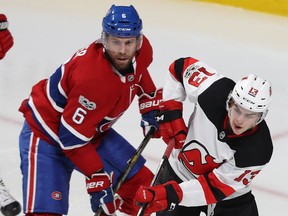 Canadiens defenceman Shea Weber and Devils centre Nico Hischier battle during game in December. Weber had surgery on Tuesday to repair a ruptured tendon in his foot.