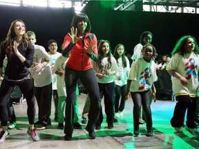 Michelle Obama dances with schoolchildren during debut of a school exercise program in February 2013 in Chicago, Illinois.