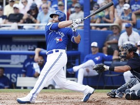 Russell Martin of the Toronto Blue Jays hits a solo home run in the second inning of a spring training game against the New York Yankees on Feb. 27, 2018, in Dunedin, Florida.