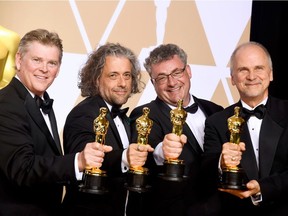 Visual effects artists Richard R. Hoover, Paul Lambert, Gerd Nefzer, and John Nelson, winners of the Best Visual Effects award for 'Blade Runner 2049,' pose in the press room during the 90th Annual Academy Awards at Hollywood & Highland Center on March 4, 2018 in Hollywood, California.
