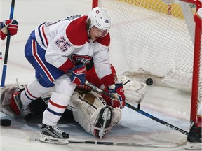 Canadiens' Jacob de la Rose interferes with Panthers goaltender Roberto Luongo in the third period Thursday night, nullifying a goal by Paul Byron.