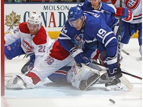 Maple Leafs' Tomas Plekanec tries to get a puck past Canadiens' Charlie Lindgren at the Air Canada Centre on Saturday, March 17, 2018, in Toronto.