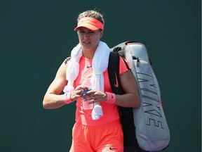 Eugenie Bouchard of Canada walks off court after losing in the final qualifying round against Rebecca Peterson of Sweden during the Miami Open presented by Itau at Crandon Park Tennis Center on  March 20, 2018 in Key Biscayne, Florida.